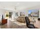 Bright living room with large windows providing lots of natural light and a sliding glass door at 9184 Se 135Th St, Summerfield, FL 34491