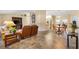 Inviting living room and dining area featuring cozy furnishings and tile flooring at 9184 Se 135Th St, Summerfield, FL 34491