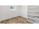 Walk-in pantry with built-in shelving and tile flooring at 9184 Se 135Th St, Summerfield, FL 34491