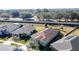 Aerial view of house and neighborhood, showcasing surrounding landscape at 96 Silver Maple Rd, Groveland, FL 34736