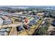 Aerial view of a home with solar panels and a lake view at 96 Silver Maple Rd, Groveland, FL 34736