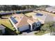 Stunning aerial view of a home with solar panels at 96 Silver Maple Rd, Groveland, FL 34736