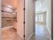 View of bathroom and hallway with tile floors at 96 Silver Maple Rd, Groveland, FL 34736