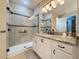 Bathroom features a large shower, granite vanity, and tile floors at 96 Silver Maple Rd, Groveland, FL 34736