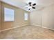 Spacious bedroom with tile flooring and ceiling fan at 96 Silver Maple Rd, Groveland, FL 34736