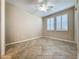 Spacious bedroom with tile flooring, ceiling fan, and large windows at 96 Silver Maple Rd, Groveland, FL 34736