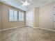 Bedroom with tile floors, ceiling fan, and window shutters at 96 Silver Maple Rd, Groveland, FL 34736