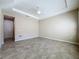 Spacious bedroom with tile flooring and ceiling fan at 96 Silver Maple Rd, Groveland, FL 34736