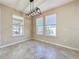 Empty dining room with tile floors and neutral walls, ready for your personal touch at 96 Silver Maple Rd, Groveland, FL 34736