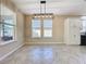 Bright dining area with tile flooring and a view into the kitchen at 96 Silver Maple Rd, Groveland, FL 34736