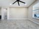 Empty Gathering room featuring tile floors and neutral walls, ready for your personal touch at 96 Silver Maple Rd, Groveland, FL 34736