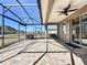 Large screened patio with paver stones and access to backyard at 96 Silver Maple Rd, Groveland, FL 34736