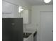 White kitchen cabinets and stainless steel appliances at 703 Sullivan Ave, Ocoee, FL 34761