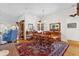 Charming dining area with a wooden table and matching chairs at 3001 Saint Thomas Ln, The Villages, FL 32162