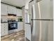 Modern kitchen with stainless steel appliances and white cabinets at 00 Mark Ave, Lady Lake, FL 32159