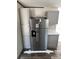 New stainless steel refrigerator with water and ice dispenser, surrounded by grey shaker cabinets at 00 Mark Ave, Lady Lake, FL 32159