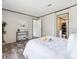 Main bedroom with wood-look floors and an ensuite bathroom at 00 Mark Ave, Lady Lake, FL 32159