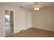 Bedroom featuring ceiling fan and sliding glass doors with closet space at 1001 Willa Lake Cir, Oviedo, FL 32765