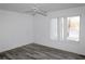 Bedroom with hard surface floor, white walls, ceiling fan, and a window at 1001 Willa Lake Cir, Oviedo, FL 32765