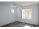 Bedroom with hard surface floor, white walls, ceiling fan, and natural light from windows at 1001 Willa Lake Cir, Oviedo, FL 32765