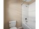 Bathroom with a toilet, bathtub, and white tile at 10962 Willow Ridge Loop, Orlando, FL 32825