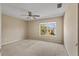 Bedroom with carpeted floor, window, and ceiling fan at 10962 Willow Ridge Loop, Orlando, FL 32825