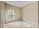 Simple bedroom with carpeted floor and a window at 10962 Willow Ridge Loop, Orlando, FL 32825