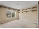 Bedroom with carpeted floors, a window, and built-in shelves at 10962 Willow Ridge Loop, Orlando, FL 32825