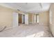 Spacious hallway with doors to bedrooms and stairs at 10962 Willow Ridge Loop, Orlando, FL 32825