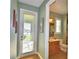 Bathroom featuring a door to lanai area at 113 Pecorri Ct, Auburndale, FL 33823