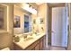 Double vanity bathroom with mirror and light fixtures at 113 Pecorri Ct, Auburndale, FL 33823