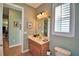 Guest bathroom with wood vanity and toilet at 113 Pecorri Ct, Auburndale, FL 33823
