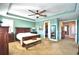 Stylish bedroom with tray ceiling, walk-in closet and ample natural light at 113 Pecorri Ct, Auburndale, FL 33823