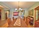 Charming dining room with chandelier and wood table, perfect for Gathering gatherings at 113 Pecorri Ct, Auburndale, FL 33823