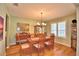 Formal dining room with hardwood floors and chandelier at 113 Pecorri Ct, Auburndale, FL 33823