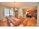 Formal dining room with hardwood floors and chandelier at 113 Pecorri Ct, Auburndale, FL 33823