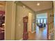 Bright entryway with tile floors, a grandfather clock and views to the living room at 113 Pecorri Ct, Auburndale, FL 33823