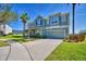 Two story home with a three car garage and manicured lawn at 113 Pecorri Ct, Auburndale, FL 33823