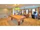 Game room with pool table, arcade game, and seating at 113 Pecorri Ct, Auburndale, FL 33823