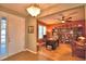 Home office with built-in bookshelves and hardwood floors at 113 Pecorri Ct, Auburndale, FL 33823