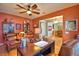 Bright home office with built-in shelving and views into the dining room at 113 Pecorri Ct, Auburndale, FL 33823
