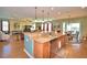 Island kitchen with granite countertops and stainless steel appliances at 113 Pecorri Ct, Auburndale, FL 33823