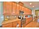 Well-equipped kitchen boasting granite counters and stainless steel appliances at 113 Pecorri Ct, Auburndale, FL 33823