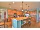 Modern kitchen with granite countertops and stainless steel appliances at 113 Pecorri Ct, Auburndale, FL 33823
