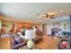 Spacious living room with hardwood floors, a fireplace, and plenty of natural light at 113 Pecorri Ct, Auburndale, FL 33823