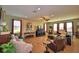 Spacious living room with tile flooring and an abundance of natural light at 113 Pecorri Ct, Auburndale, FL 33823