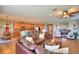 Open living room features a spacious leather sectional and a cozy fireplace at 113 Pecorri Ct, Auburndale, FL 33823