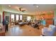 Open-concept living space with a large sectional sofa and breakfast bar at 113 Pecorri Ct, Auburndale, FL 33823