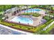 Community pool area with multiple pools, lounge chairs, and a shaded area at 113 Pecorri Ct, Auburndale, FL 33823