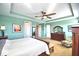 Primary bedroom with large bed, and walk-in closet at 113 Pecorri Ct, Auburndale, FL 33823